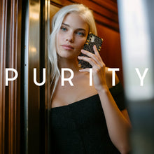 Load image into Gallery viewer, A woman holding a black glitter phone case by PURITY.