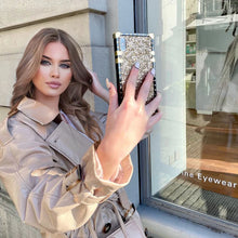 Load image into Gallery viewer, Motorola Case &quot;Pyrite&quot; | Gold Glitter Square Phone Case in the hands of a beautiful model | PURITY
