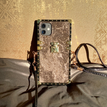 Load image into Gallery viewer, Brown marble iPhone case by PURITY with black leather crossbody strap.