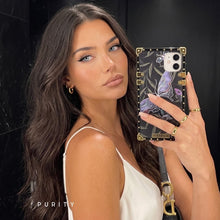 Load image into Gallery viewer, Woman holding a phone with a purple butterfly iPhone case by Maison Purity
