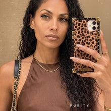 Load image into Gallery viewer, Woman holding a luxury leopard print iPhone case by Maison Purity
